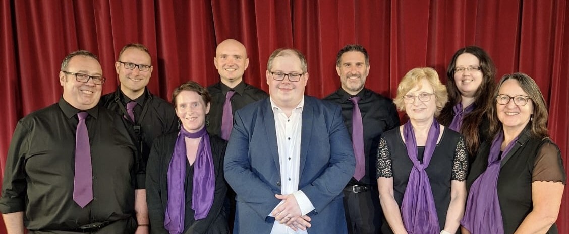 pictured: members of the committee with the musical director